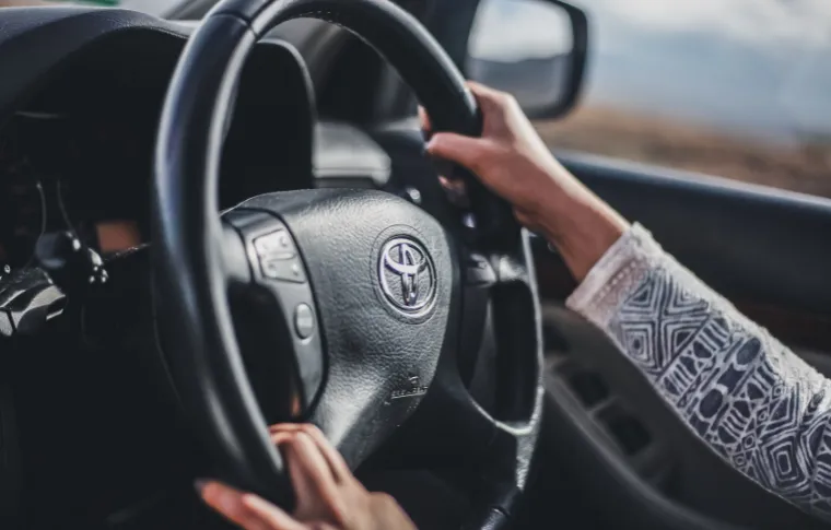 A woman driving a car.